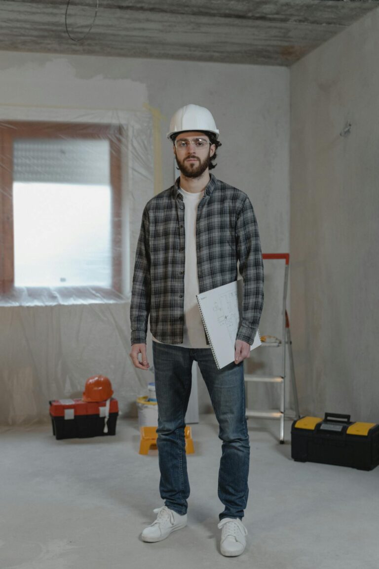 Man in Black and White Plaid Dress Shirt Holding White Paper